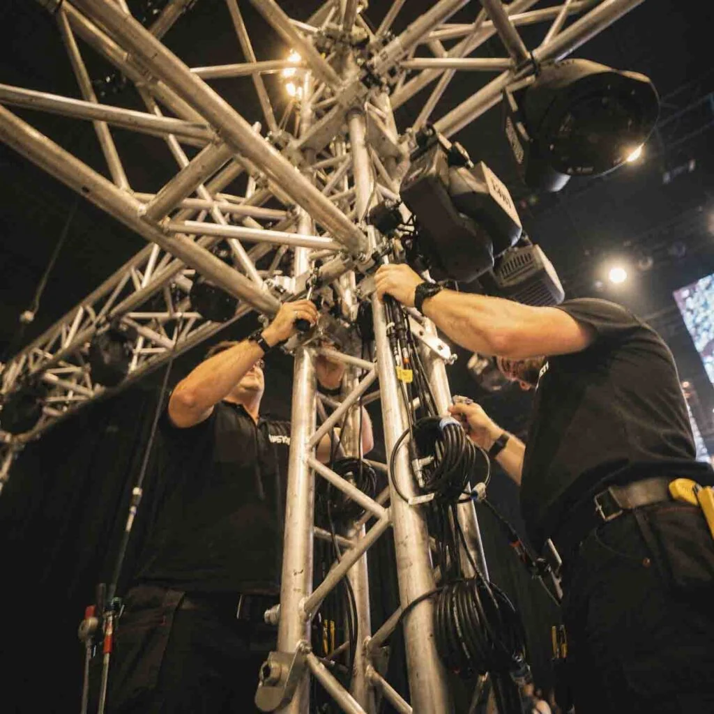 Technical crew working on stage rigging