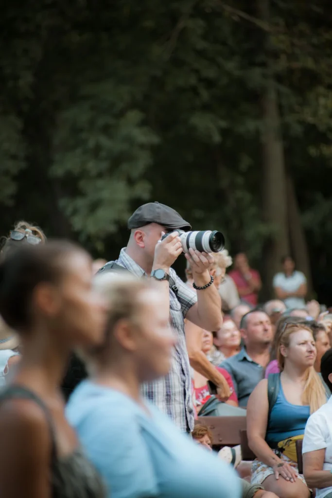 A photographer capturing moments at an outdoor event