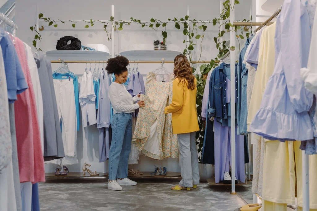 Customers discovering clothing in a bright boutique