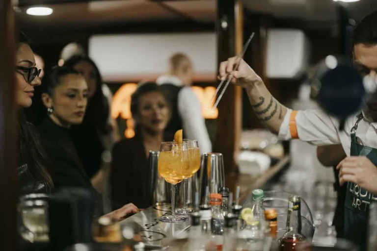 Drinks being served at the bar · AFLOAT — Exclusive Networking at Sea