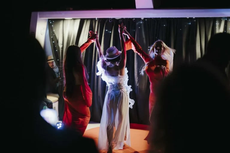 Performers on the deck stage · AFLOAT — Exclusive Networking at Sea