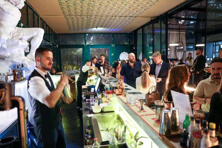 Bar service and guests at Altitude × EveryMatrix in Lisbon.
