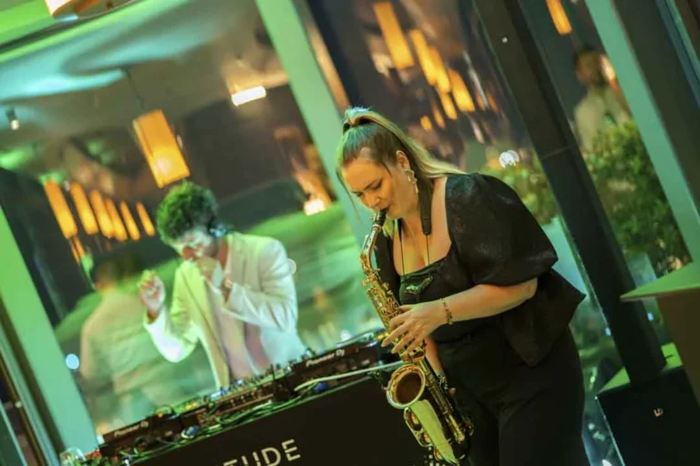 A live saxophone performance · Above the island