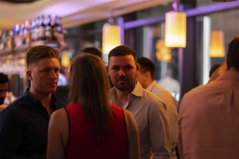 Guests talking in the lounge · Above the island