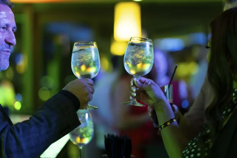 A rooftop toast · Above the island